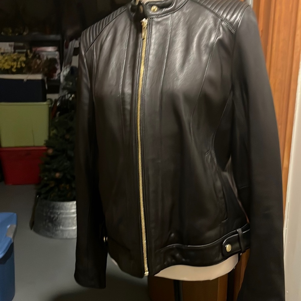 Coke Haan black leather jacket, size large zip up and zipper on sleeves